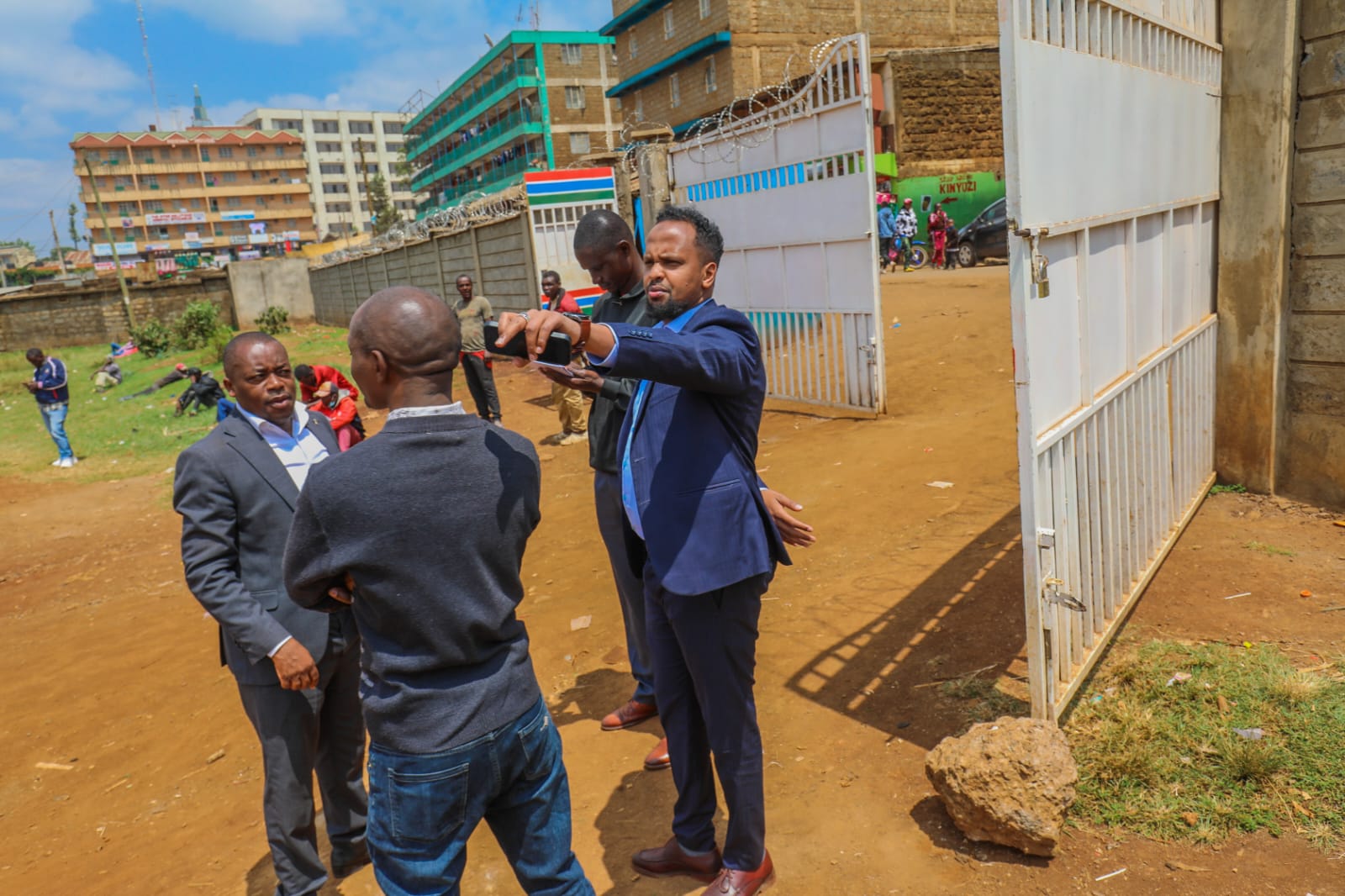 Officials reviewing the stadium entrance and gate works