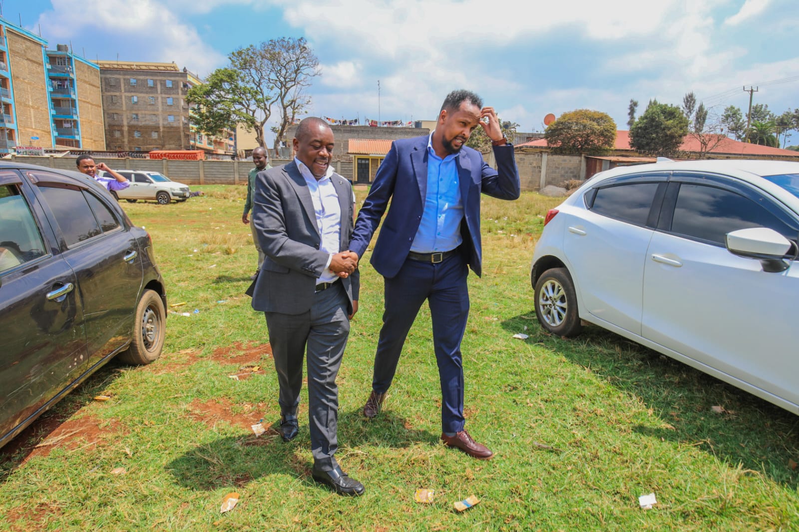 Hon. Joseph Muhinja Kamau greeting the CECM for Sports on site